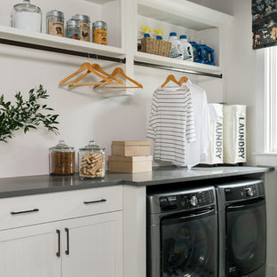 Inspiration for a small classic separated utility room in Chicago with white cabinets, white walls, an integrated washer and dryer and grey worktops.