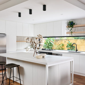 Scandinavian White Kitchen with Fluted Paneling