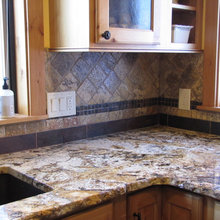 Brown backsplash idea with brown swirls granite