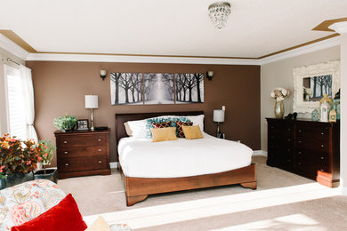 This is an example of a large traditional master bedroom in Calgary with beige walls, carpet and no fireplace.