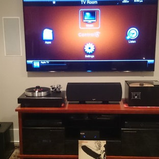 Home theater - small contemporary enclosed carpeted home theater idea in Cleveland with beige walls and a wall-mounted tv