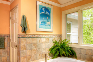 Bathroom - large traditional master beige tile ceramic tile bathroom idea in New York with a console sink, white cabinets and orange walls