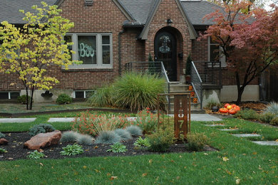 Design ideas for a small contemporary front yard partial sun xeriscape for fall in Salt Lake City with concrete pavers.