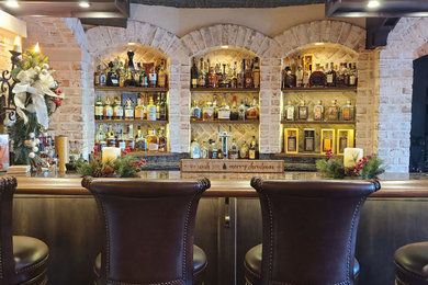Home bar - mediterranean home bar idea in Grand Rapids