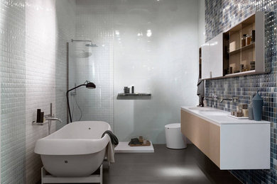 Example of a trendy green tile and ceramic tile freestanding bathtub design in New York