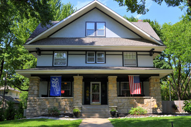 Example of a large arts and crafts three-story exterior home design in Kansas City