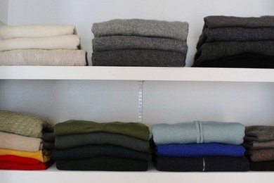Mid-sized elegant reach-in closet photo in New York