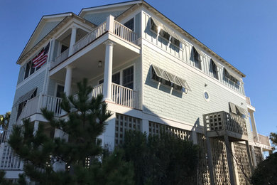 Example of a transitional exterior home design in Charleston