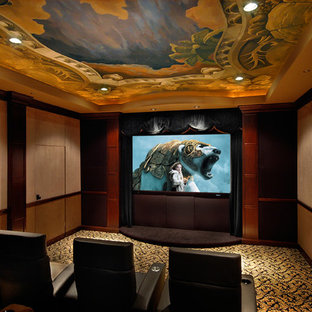 This is an example of a large classic enclosed home cinema in Houston with beige walls, carpet, a wall mounted tv and yellow floors.