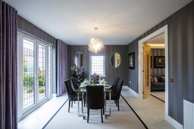Transitional separate dining room in Glasgow with multi-coloured walls, no fireplace and beige floor.