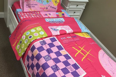 Photo of a small modern kids' bedroom for kids 4-10 years old and girls in Charlotte with pink walls and carpet.