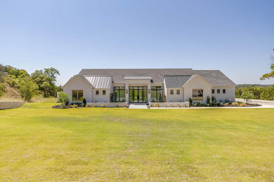 Large minimalist white brick house exterior photo in Dallas