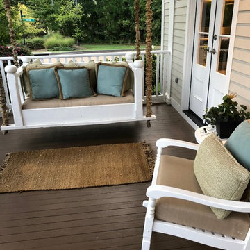 Textured tweed cushions on porch swing and rocker
