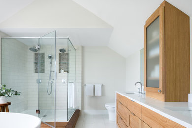 Large trendy master white tile and ceramic tile porcelain tile and double-sink bathroom photo in Burlington with shaker cabinets, light wood cabinets, a two-piece toilet, an undermount sink, quartz countertops, a hinged shower door, white countertops, a niche and a built-in vanity