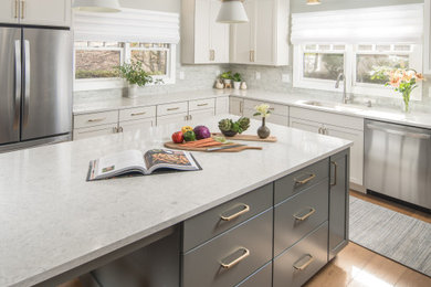 Inspiration for a mid-sized transitional u-shaped medium tone wood floor eat-in kitchen remodel in Other with an undermount sink, shaker cabinets, quartz countertops, green backsplash, subway tile backsplash, stainless steel appliances and an island