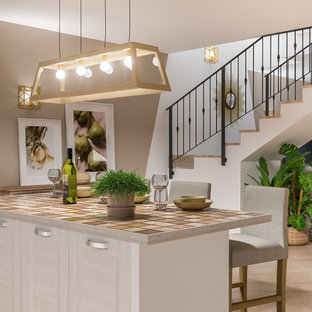 Photo of a large mediterranean walk-out basement in Milan with multi-coloured walls, terracotta flooring and pink floors.