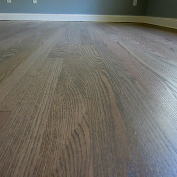 NISSEQUOGUE:  2 1/4" RED OAK W/ CUSTOM GREY BLEND STAIN + BONA TRAFFIC HD SATIN