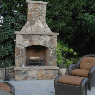 Outdoor Stone Fireplace w arched opening and keystone, poolside