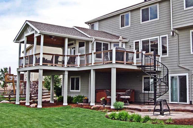 Large elegant gray two-story wood exterior home photo in Denver with a shingle roof