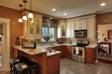 Inspiration for a mid-sized timeless u-shaped linoleum floor and beige floor eat-in kitchen remodel in Baltimore with a single-bowl sink, shaker cabinets, medium tone wood cabinets, granite countertops, stainless steel appliances and a peninsula