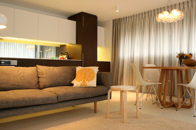 This is an example of a small modern open concept living room in Sydney.