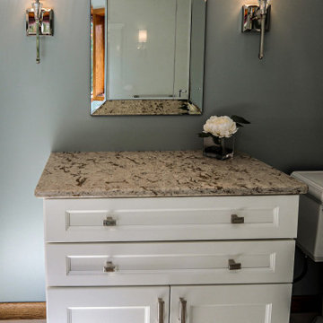 White Master Bathroom with Freestand Tub and Corian Solid Surface Shower