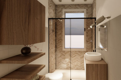 Foto di un bagno di servizio con WC sospeso, lavabo a bacinella e mobile bagno sospeso