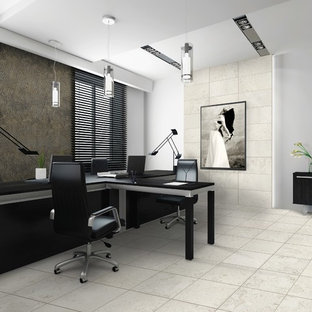 Inspiration for a medium sized modern home office and library in Toronto with white walls, travertine flooring and a freestanding desk.