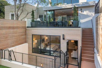 Mid-sized contemporary white three-story stucco flat roof idea in San Francisco