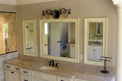 Bathroom - mid-sized traditional 3/4 gray tile, white tile and stone slab dark wood floor bathroom idea in Raleigh with flat-panel cabinets, dark wood cabinets, a one-piece toilet, beige walls, a drop-in sink and solid surface countertops