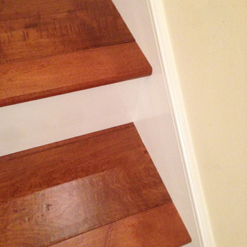 Maple wood stair install with white faces