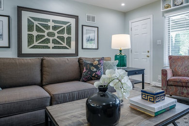 Example of a transitional family room design in Grand Rapids