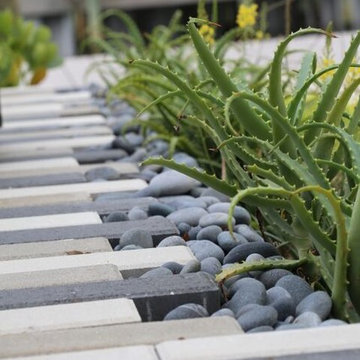 Plank Pavers & Pebbles make a stunning Design