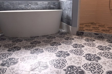 Inspiration for a large transitional master white tile ceramic tile bathroom remodel in Jacksonville with shaker cabinets, white cabinets and blue walls