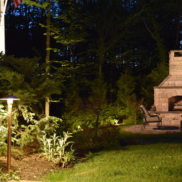 Outdoor fireplace, fire pit, outdoor kitchen and stone lighting in New Jersey