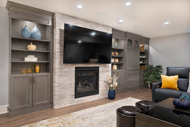 Inspiration for a large transitional enclosed family room remodel in Other with a bar, a standard fireplace, a stacked stone fireplace and a media wall
