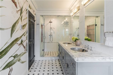 Mid-sized tuscan master white tile and subway tile mosaic tile floor and white floor freestanding bathtub photo in Philadelphia with recessed-panel cabinets, gray cabinets, a two-piece toilet, multicolored walls, an undermount sink, marble countertops and gray countertops