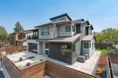 Mid-sized contemporary gray two-story concrete fiberboard gable roof idea in San Francisco
