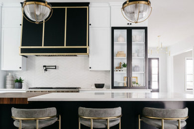 Transitional l-shaped kitchen photo in Chicago with white backsplash, stainless steel appliances, an island, white countertops and a farmhouse sink