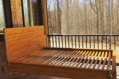 Large elegant screened-in back porch photo in Atlanta with a roof extension