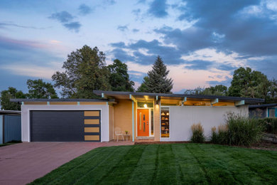 Example of a 1960s exterior home design in Denver