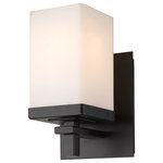 Golden Lighting - Maddox 1-Light Wall Sconce in Matte Black - This clean modern design is suitable for transitional to contemporary homes. The Matte Black finish and Square Opal Glass shades enhance the series' elegant look. The fixture is UL/cUL approved for damp location installation and provides well diffused light over a vanity or mirror. The fixture offers a reversible up or down install to suit your style.&nbsp