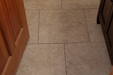 Bathroom - mid-sized modern white tile and ceramic tile ceramic tile, beige floor and single-sink bathroom idea in Minneapolis with brown cabinets, a two-piece toilet, an integrated sink, a niche and a freestanding vanity