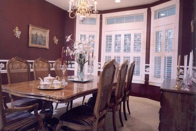Large carpeted kitchen/dining room combo photo in Austin with red walls