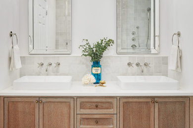 Mid-sized eclectic master white tile and terra-cotta tile marble floor and white floor bathroom photo in Chicago with furniture-like cabinets, distressed cabinets, a one-piece toilet, white walls, a vessel sink, quartz countertops and white countertops