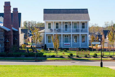 Mid-sized traditional beige two-story concrete fiberboard exterior home idea in Other
