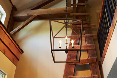 The Barn Entry; original beams; hayloft ladder; rustic; iron; chandalier