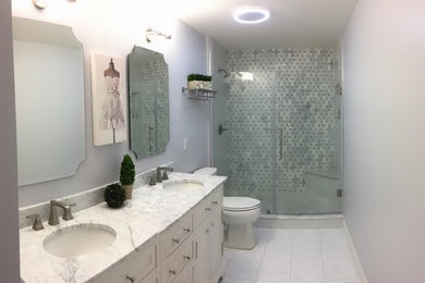 Mid-sized transitional master gray tile and marble tile marble floor and white floor alcove shower photo in Columbus with recessed-panel cabinets, white cabinets, gray walls, an undermount sink, marble countertops, a hinged shower door and gray countertops