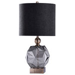 Harp and Finial - Richmond Table Lamp Smoke Finish on Glass Body With Brass Finish on Metal Body - The Fenwick Table Lamp is a bold fixture with artistic elements, including a brass metal base, a smoke glass frame, and a black linen shade. A sphere made up of countless flat faces joined at unique angles, the glass body is a stunning design feature that accentuates both the lustrous metal elements and the dark fabric shade. Make a statement in any room by adding this lamp to a nightstand or side table.