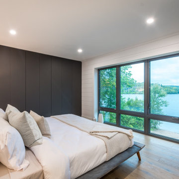 Modern Muskoka Cottage Bedroom with Floor to Ceiling Wardrobes: Huntsville, ON